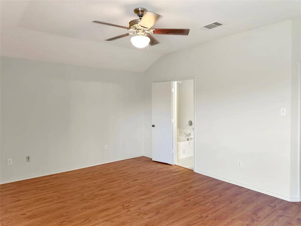 3457 Newgate Street, Midlothian, TX 76065 Primary bedroom featuring wood finished floors, lofted ceiling, and a ceiling fan