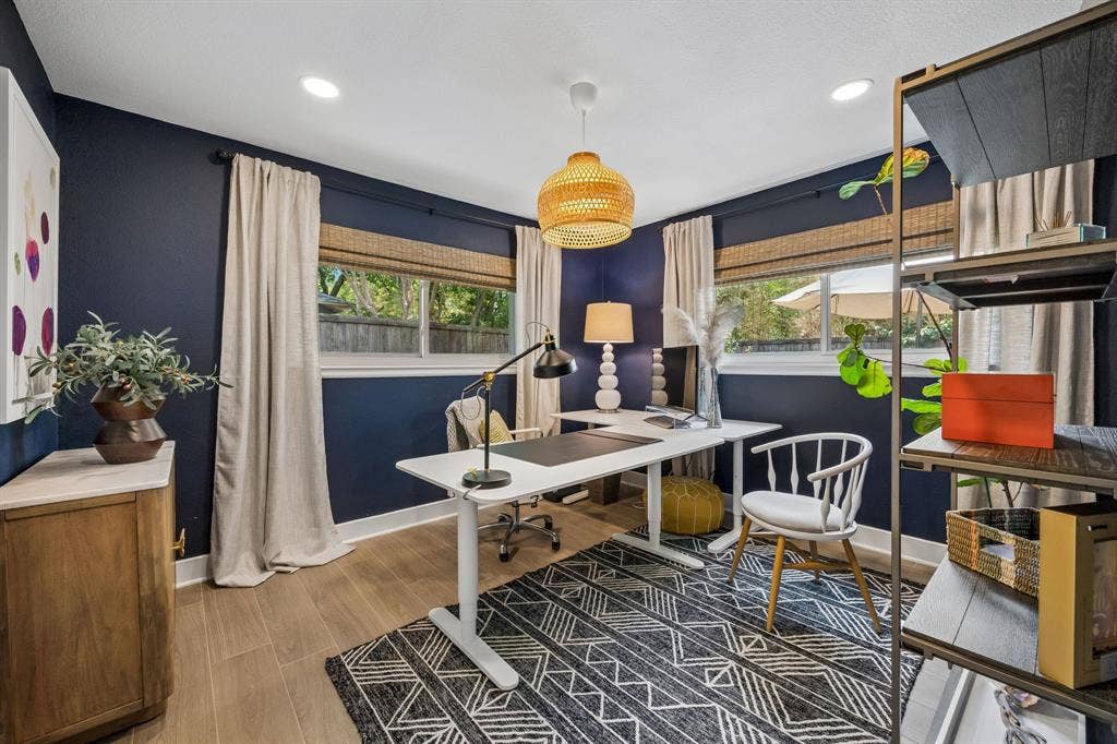 Wood-finish look tile flooring, recessed lighting, and a woven pendant light fixture