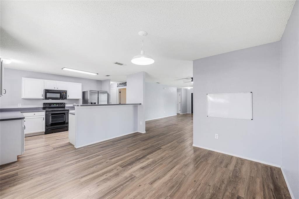 117 Palomino Lane, Krum, TX 76249 Dining room is open to the large kitchen and living room