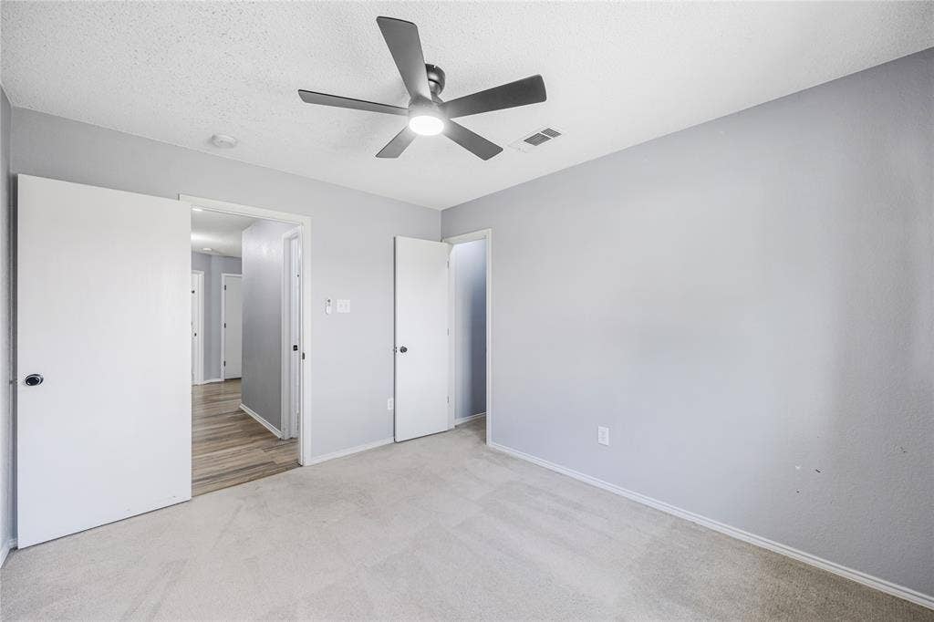 117 Palomino Lane, Krum, TX 76249 This secondary bedroom also features a large walk-in closet.