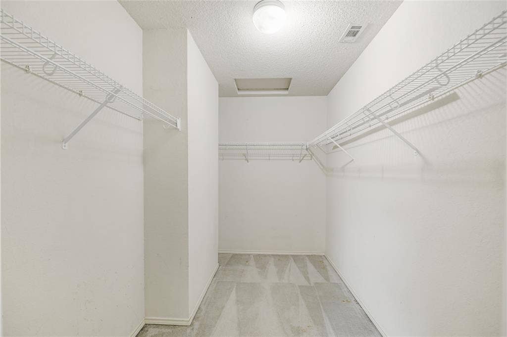 117 Palomino Lane, Krum, TX 76249 Take a look at this 11' walk-in closet in the primary suite