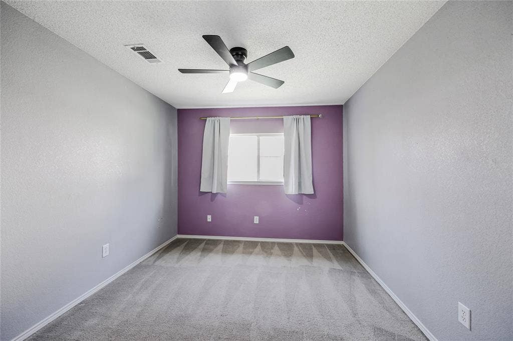 117 Palomino Lane, Krum, TX 76249 Secondary split bedroom with accent wall, ceiling fan wiht light