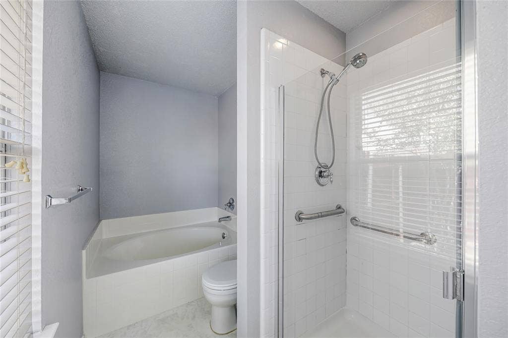 117 Palomino Lane, Krum, TX 76249 Separate garden tub and shower are great features of this Primary suite