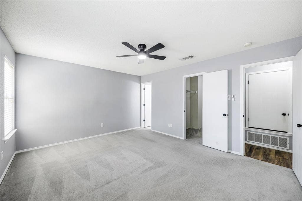 117 Palomino Lane, Krum, TX 76249 Another view of this large primary suite with a 11' walk-in closet and ensuite bathroom