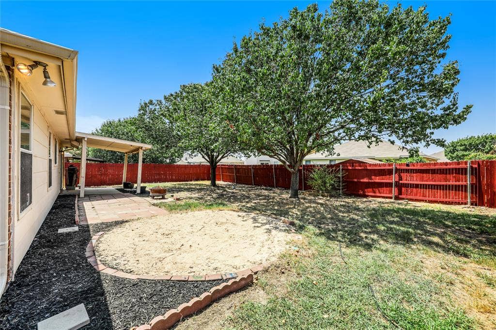 117 Palomino Lane, Krum, TX 76249 Kids will have fun in this sandbox just off the extended patio