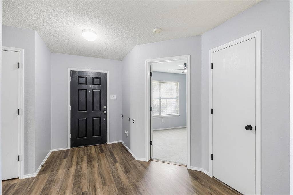117 Palomino Lane, Krum, TX 76249 Walk into foyer featuring a coat closet, linen closet and entry into front bedroom.