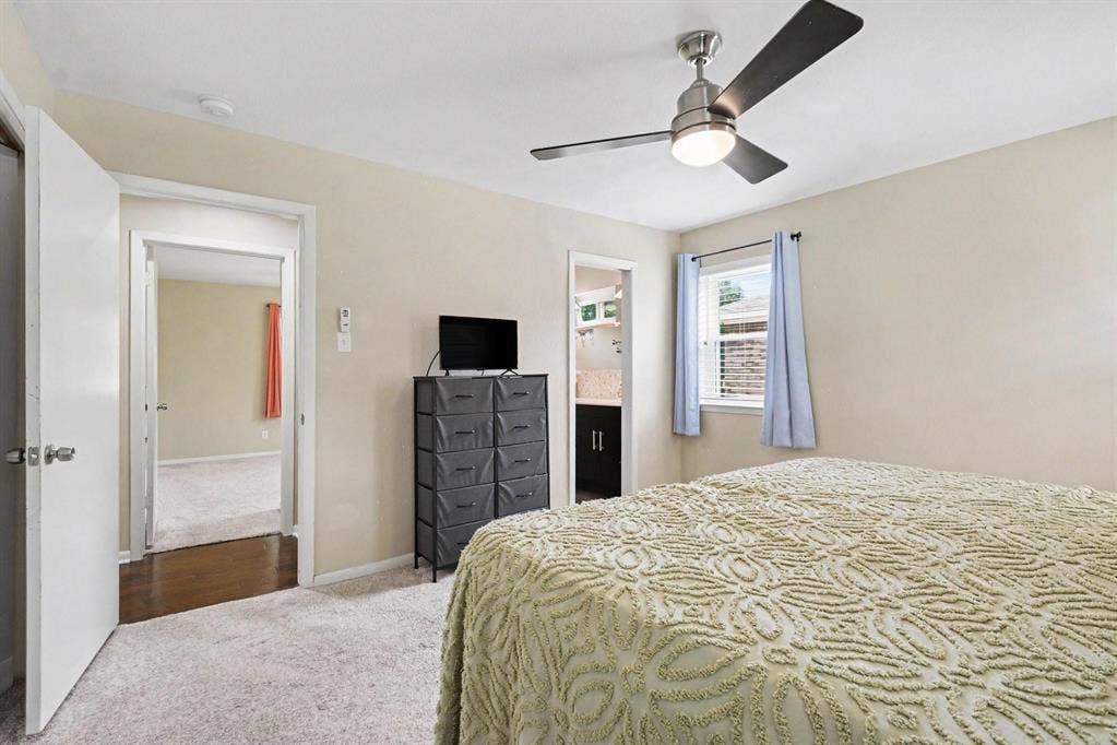 1114 Glouchester Drive, Garland, TX 75040 Recessed window with blinds, ceiling fan with integrated lighting, and neutral wall paint