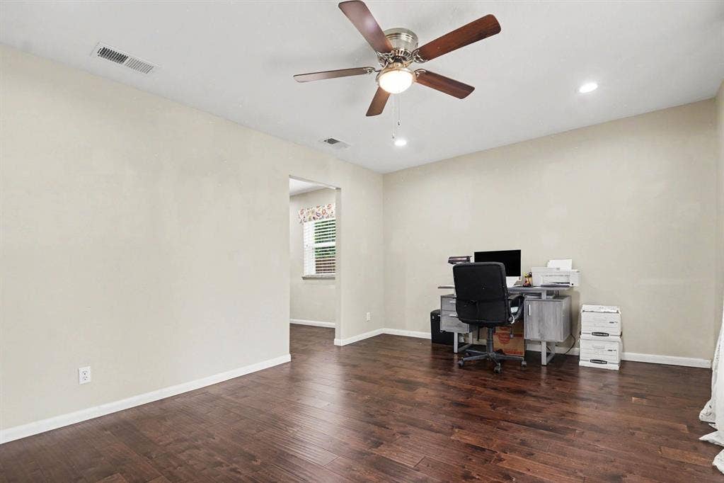 1114 Glouchester Drive, Garland, TX 75040 Hardwood-finish flooring, recessed lighting, and a ceiling fan with light fixture