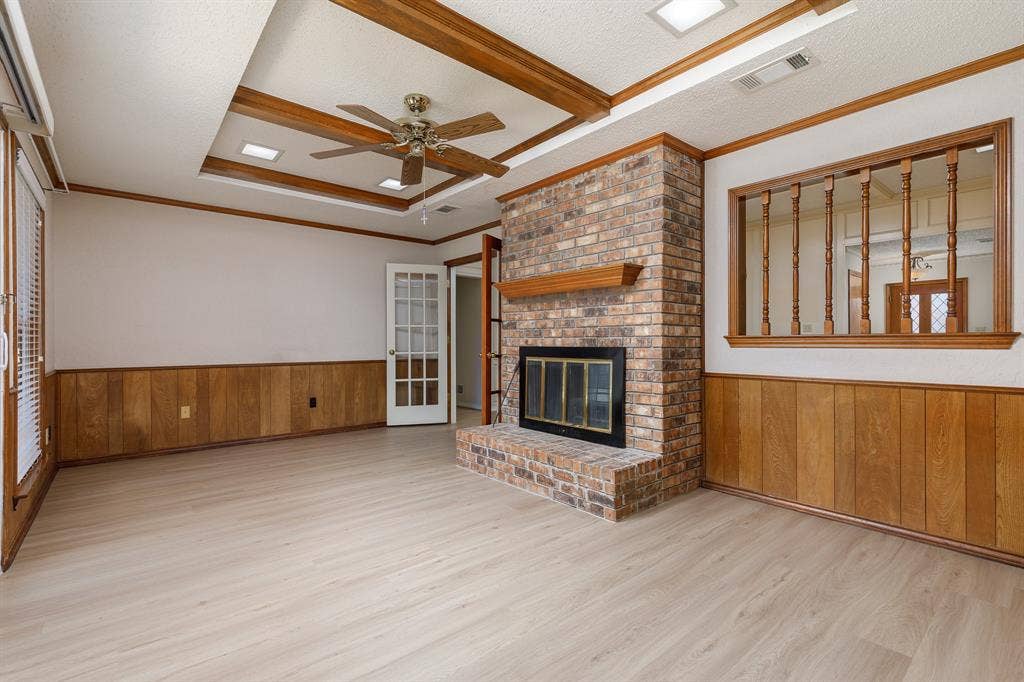 2526 Willowdale Drive, Carrollton, TX 75006 Brick-faced fireplace with a wood mantel
