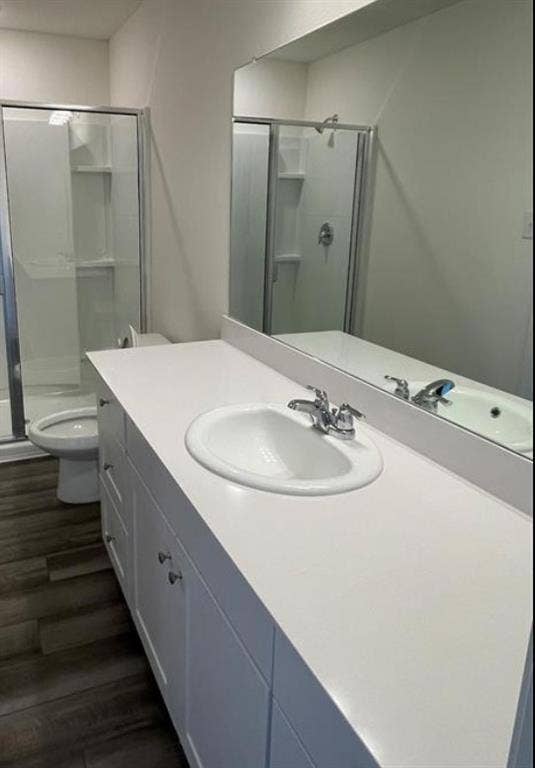 1903 Marquette Drive, Princeton, TX 75407 White vanity with an integrated sink, chrome faucet, and expansive wall-mounted mirror