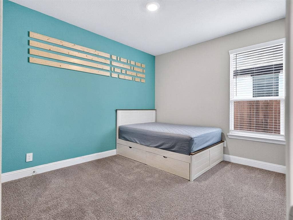 2504 Wren Lane, Denton, TX 76205 Plush carpet flooring, recessed ceiling lighting, and a window with blinds
