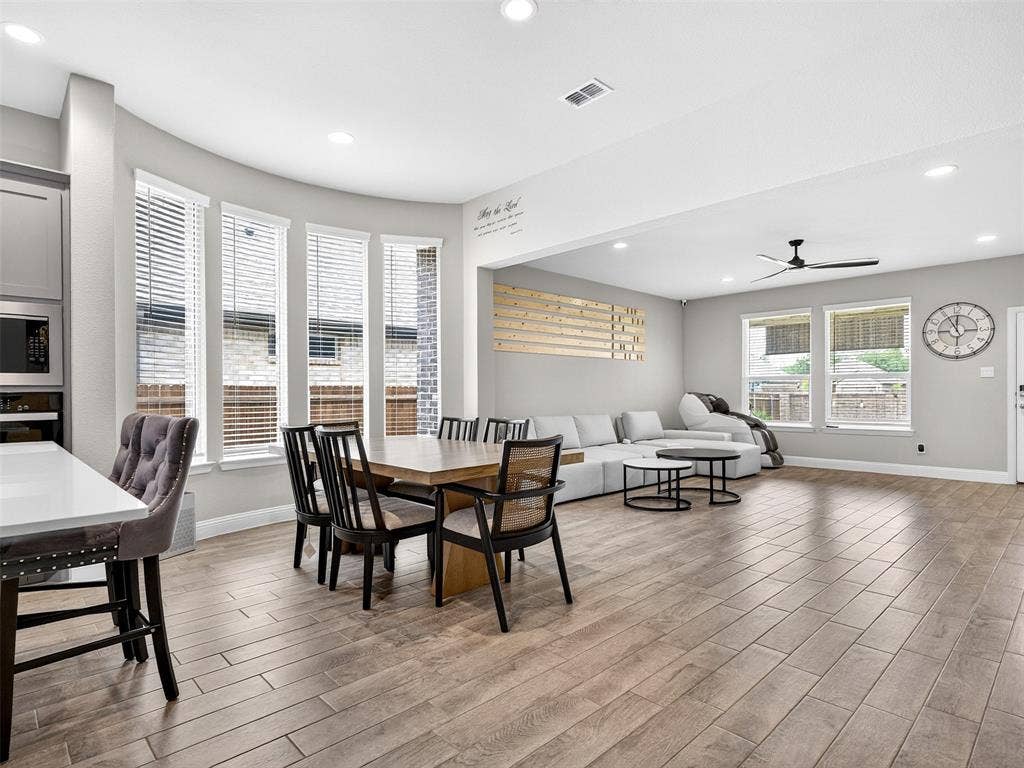 2504 Wren Lane, Denton, TX 76205 Open-concept living space featuring wood-finish flooring, recessed lighting, and a ceiling fan