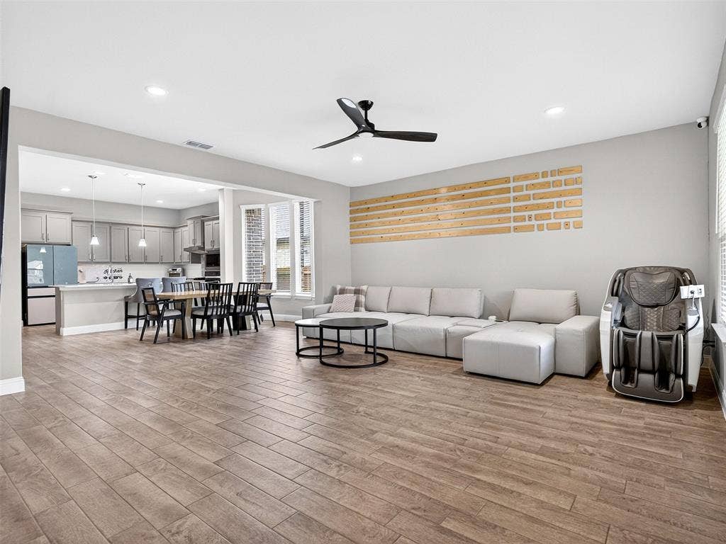 2504 Wren Lane, Denton, TX 76205 Open-concept living space featuring wood-finish flooring, recessed lighting, and a ceiling fan