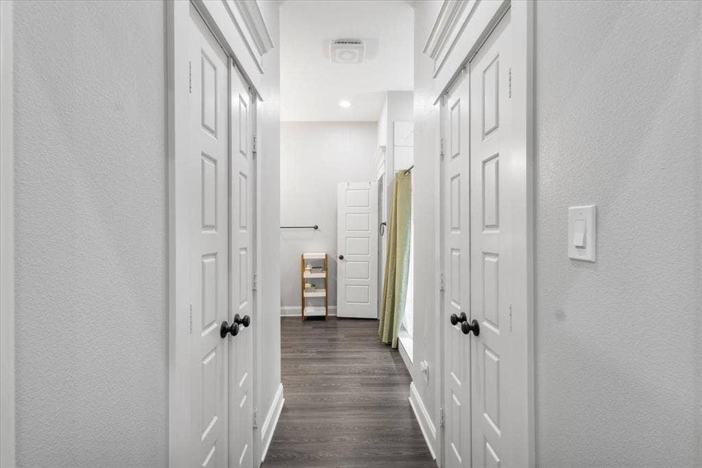 16136 County Road 1134=, Tyler, TX 75709 Hallway with wood-finish flooring, white panel doors, and recessed lighting