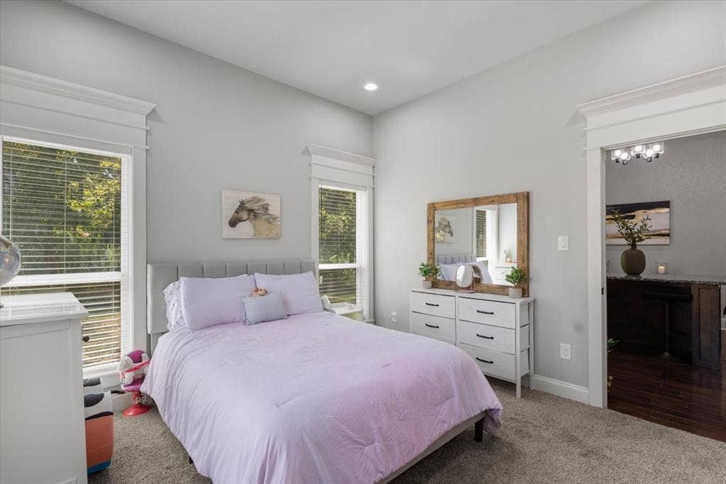 16136 County Road 1134=, Tyler, TX 75709 Neutral wall color, recessed lighting, carpet flooring, two windows with blinds, and white trim work
