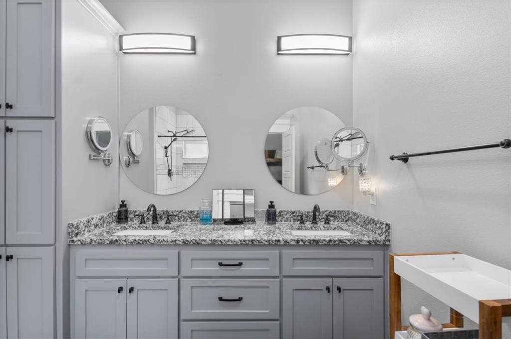 16136 County Road 1134=, Tyler, TX 75709 Double vanity with stone countertop, undermount sinks, and built-in cabinetry