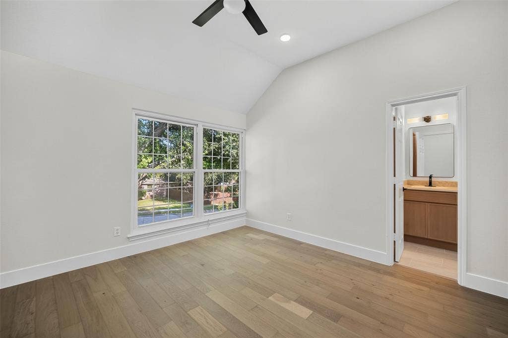 3041 Hillingdon Drive, Richardson, TX 75082 Vaulted ceiling with a ceiling fan, wood-finish flooring, and a double window