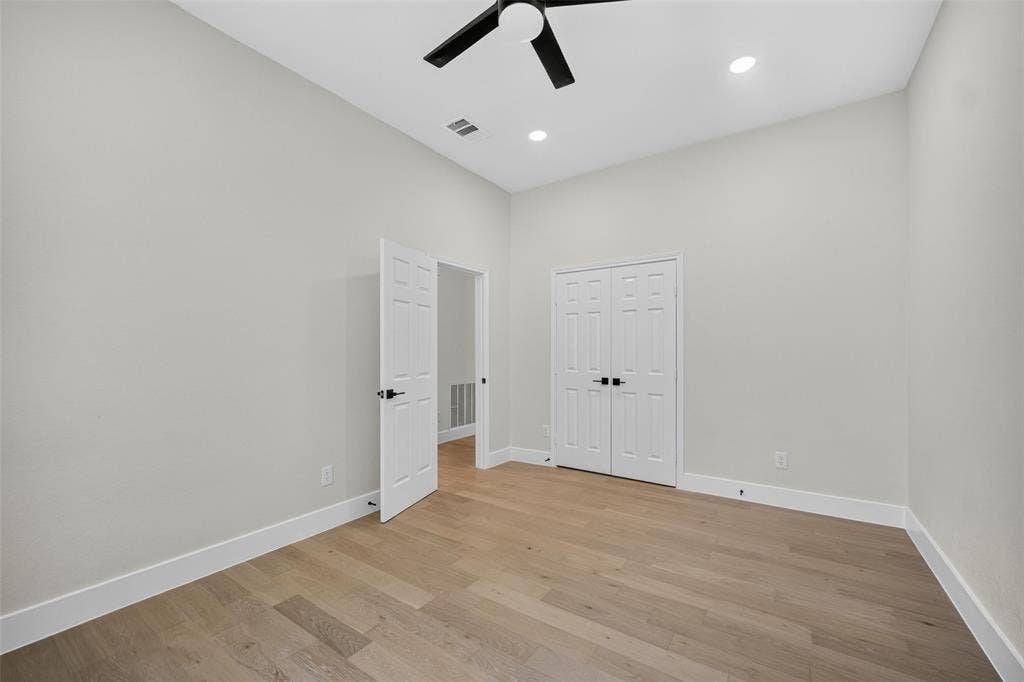 3041 Hillingdon Drive, Richardson, TX 75082 Vaulted ceiling with a ceiling fan, recessed lighting, wood-finish flooring, and white trim