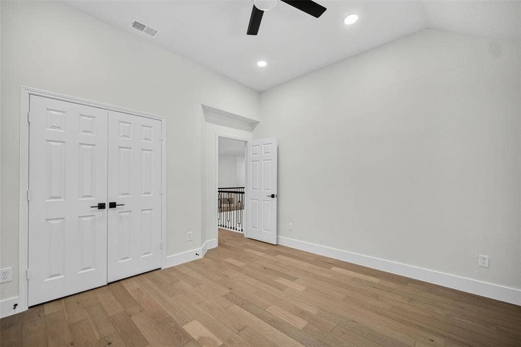 3041 Hillingdon Drive, Richardson, TX 75082 Vaulted ceiling, recessed lighting, wood-finish flooring, two-panel interior doors, and a ceiling fan