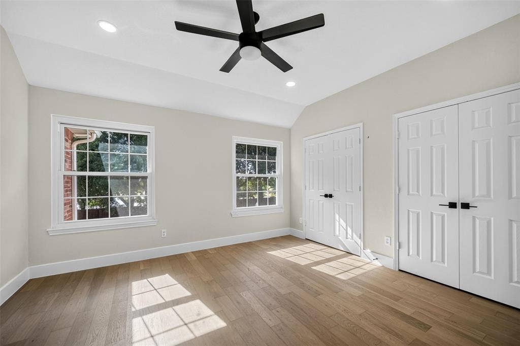 3041 Hillingdon Drive, Richardson, TX 75082 Vaulted ceiling with a ceiling fan, recessed lighting, wood-finish flooring, two double-door closets, and two windows