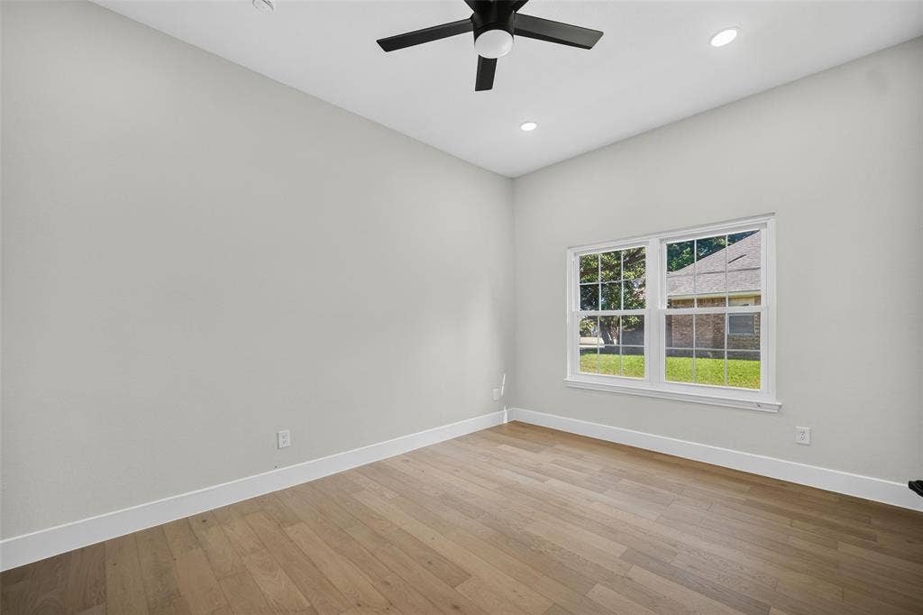 3041 Hillingdon Drive, Richardson, TX 75082 Wood-finish flooring with white trim, a double window, recessed lighting, and a ceiling fan