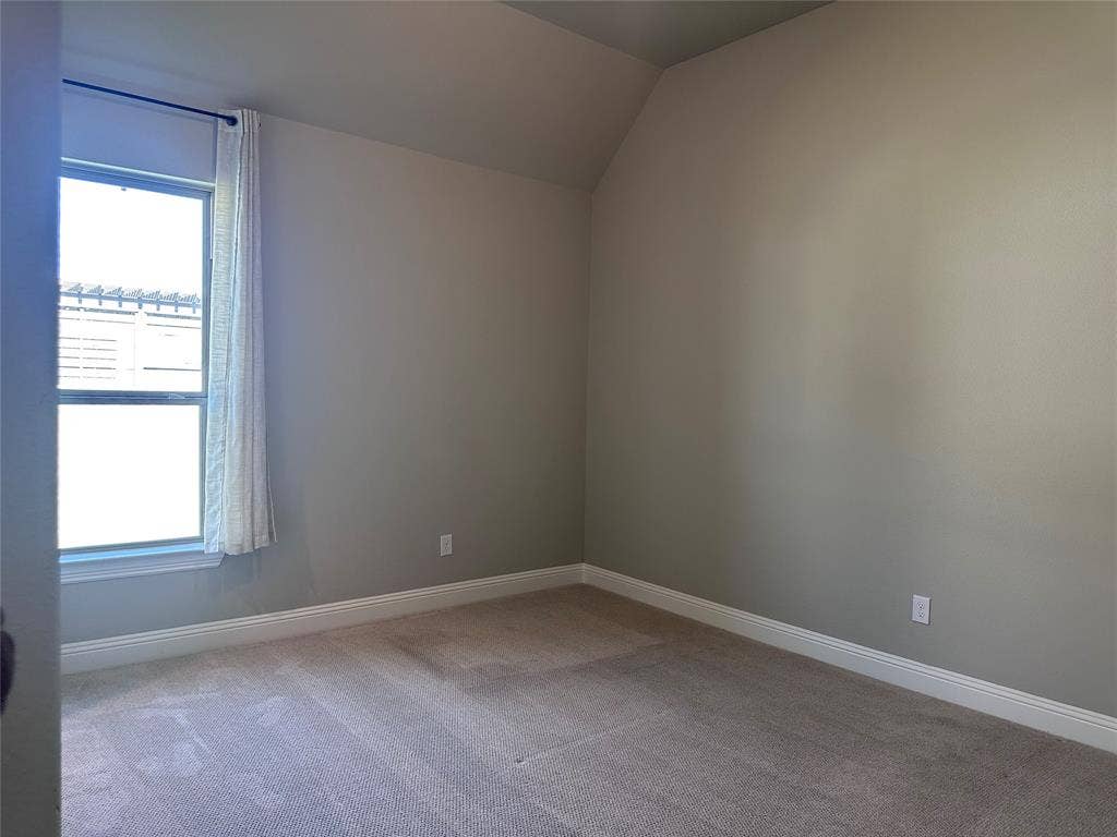 2608 Roaming Trail, Northlake, TX 76247 Carpeted flooring, neutral wall paint, and a window with a curtain rod
