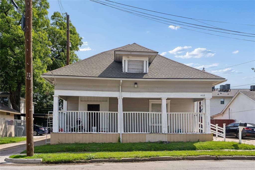 4112 Congress Avenue, Dallas, TX 75219 Gable roof with dormer window, full-width front porch, white porch railing, and light-colored siding