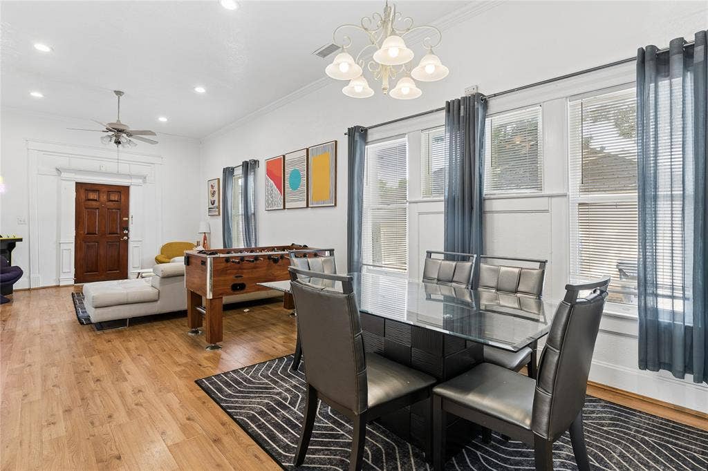 4112 Congress Avenue, Dallas, TX 75219 Open-concept living area featuring wood-finish flooring, recessed lighting, and a decorative ceiling fan