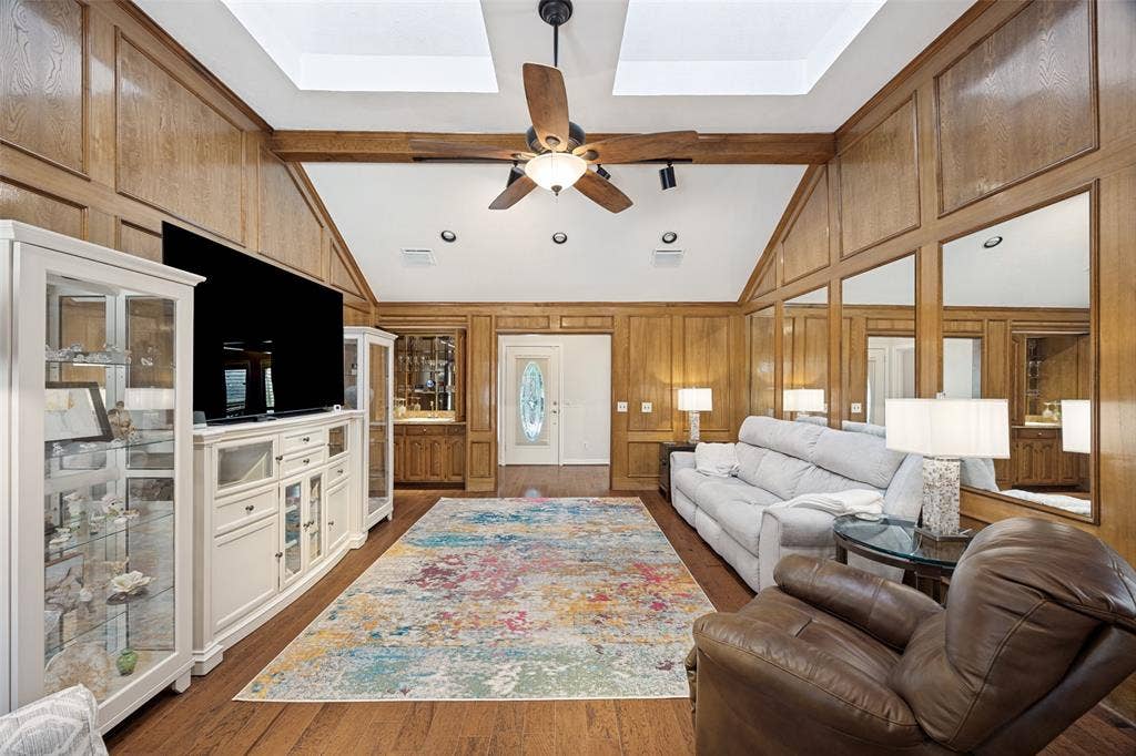 6223 Fox Trail, Dallas, TX 75248 Hardwood floors and wood paneling add a warm ambiance.