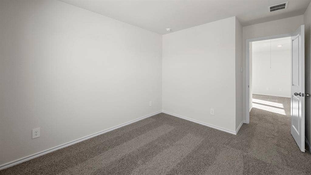 5028 Shumard Drive, Lindale, TX 75771 Neutral wall color, carpeted flooring, and white trim