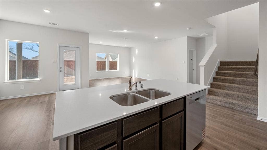 5028 Shumard Drive, Lindale, TX 75771 Kitchen island with a double basin stainless steel sink and integrated dishwasher