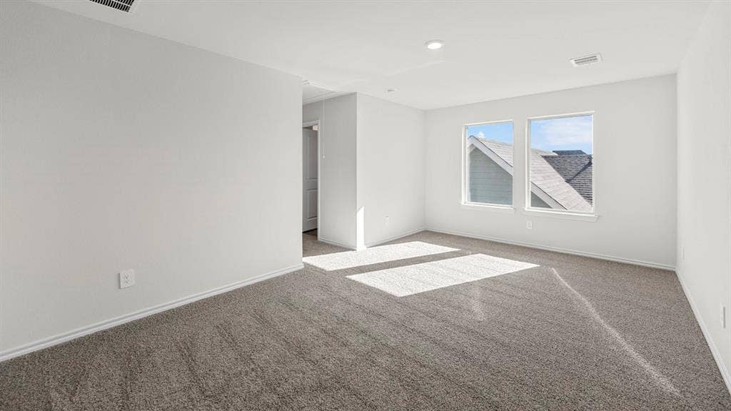 5028 Shumard Drive, Lindale, TX 75771 Carpeted flooring, white painted walls, recessed lighting, and two windows