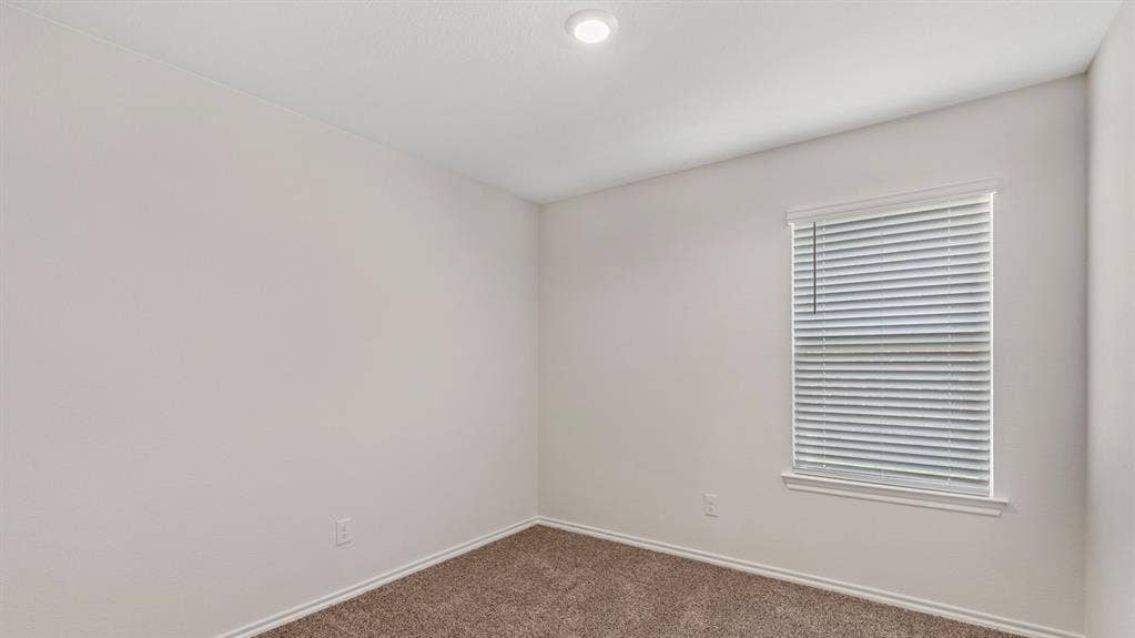 3037 Hidden Valley Drive, Lindale, TX 75771 Recessed ceiling lighting, textured wall finish, window with horizontal blinds, and carpeted flooring