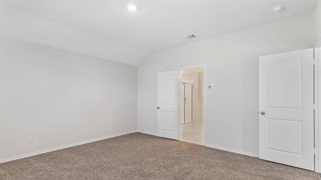 3037 Hidden Valley Drive, Lindale, TX 75771 Vaulted ceiling with recessed lighting, light gray carpet flooring, and white interior doors
