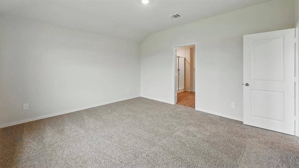 181 Brooks Street, Bullard, TX 75757 Neutral-toned carpeting, recessed ceiling lighting, and a white interior door