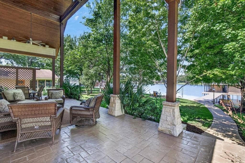 117 Arrowhead Way, Mabank, TX 75156 Tongue and groove wood ceilings, huge fans, spider system for less mess and look at these shady lake views!