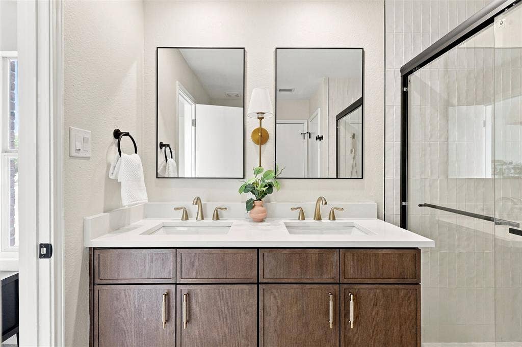 1406 Quail Meadow Drive, Wylie, TX 75098 Dual vanity with a white countertop and integrated sinks