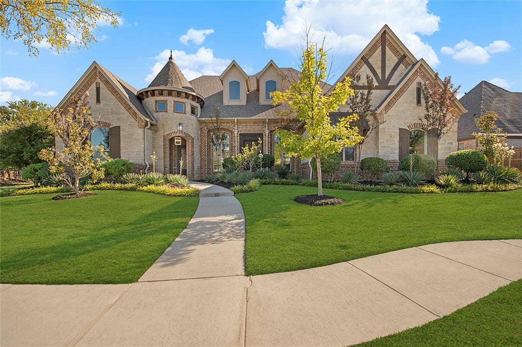 Stone and brick exterior with a turret entry