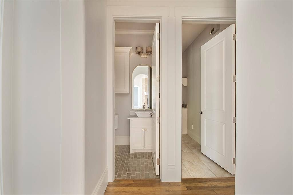 Wood-finish flooring throughout the hallway