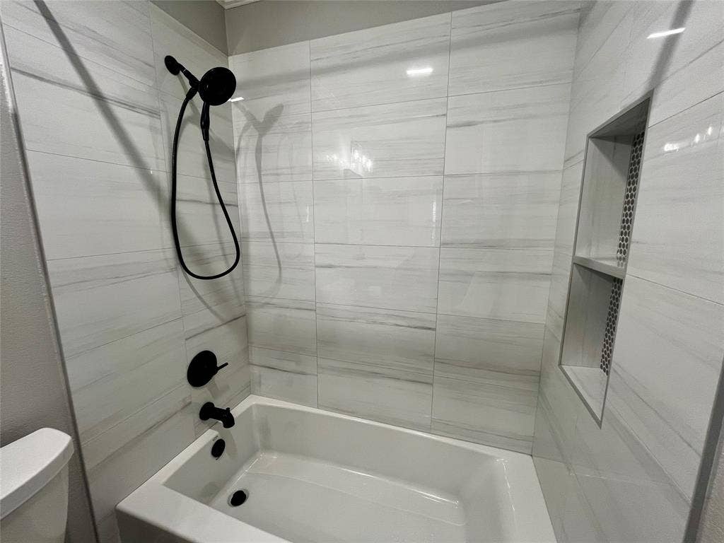 4100 Burnhill Drive, Plano, TX 75024 Hall bath remodeled tub and tile, hardware