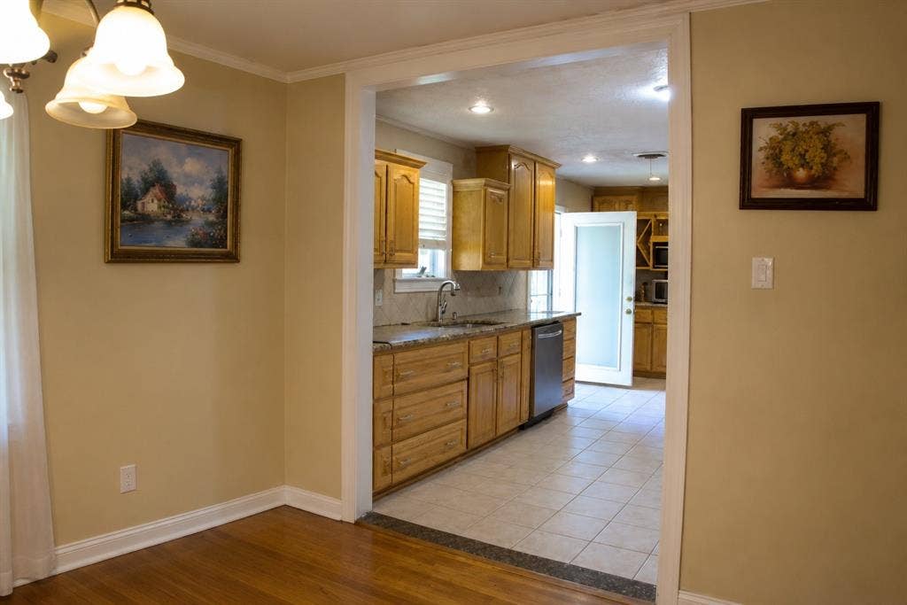 5012 Wateka Drive, Dallas, TX 75209 Hardwood flooring, cased opening, wood cabinetry, stone countertops, stainless steel dishwasher
