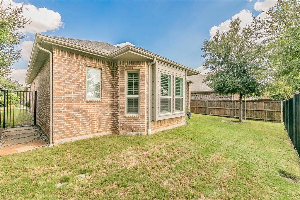 313 Elkhorn Trail, Keller, TX 76248 Brick exterior featuring a bay window