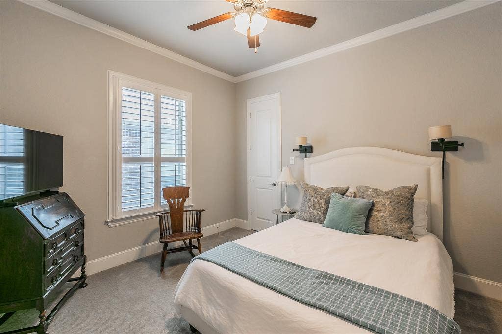 313 Elkhorn Trail, Keller, TX 76248 Recessed window with plantation shutters, ceiling fan with integrated lighting, and crown molding