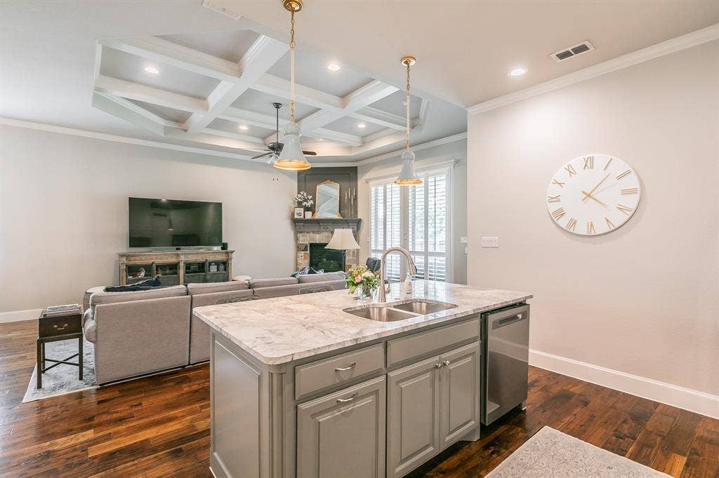 313 Elkhorn Trail, Keller, TX 76248 Kitchen island with an undermount double-basin sink, stainless steel dishwasher, and pendant lighting