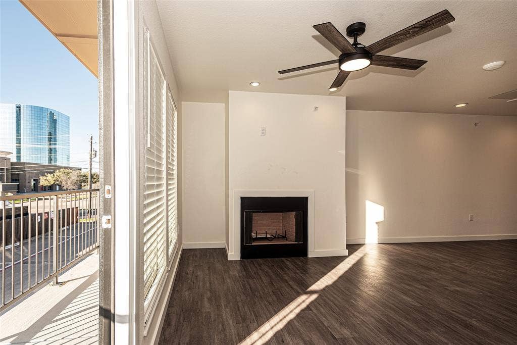 3022 Forest Lane, #116, Dallas, TX 75234 living room featuring the 2nd balcony and private door
