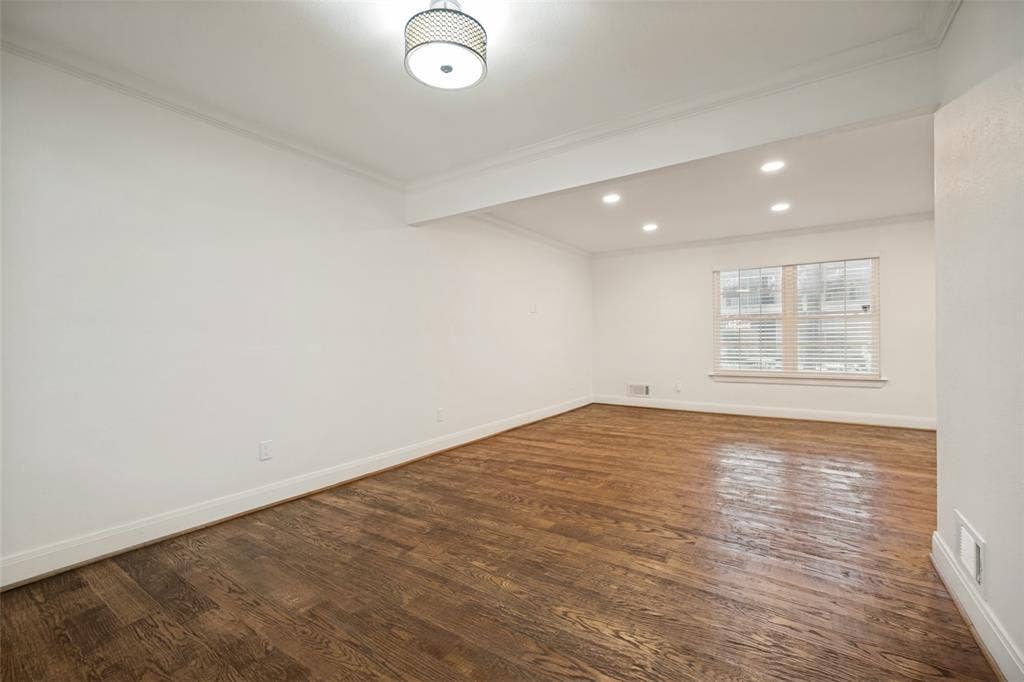 5818 E University Boulevard, #138, Dallas, TX 75206 Wood-finish flooring, white walls, recessed lighting, and a drum pendant light fixture