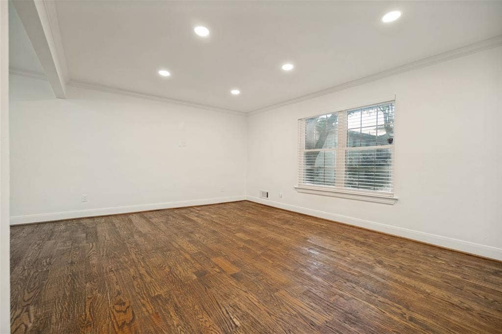 5818 E University Boulevard, #138, Dallas, TX 75206 Hardwood flooring, recessed ceiling lighting, crown molding, and a window with blinds