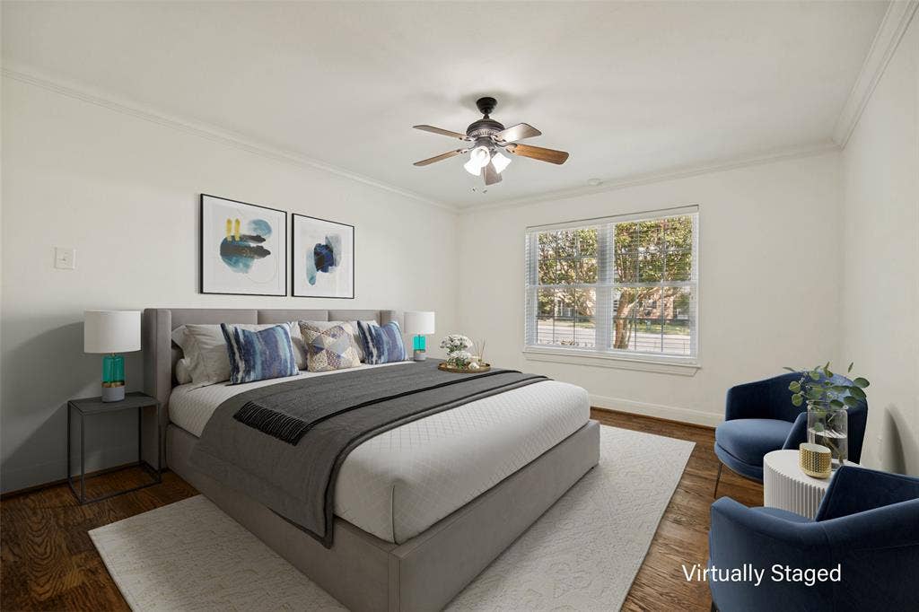 5818 E University Boulevard, #138, Dallas, TX 75206 Wood-finish flooring, crown molding, and a ceiling fan with integrated lighting