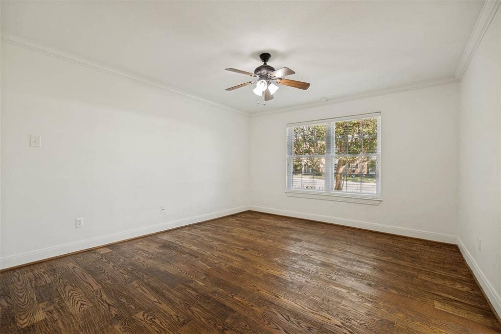 5818 E University Boulevard, #138, Dallas, TX 75206 Wood-finish flooring, ceiling fan with integrated lighting, crown molding, and window with blinds
