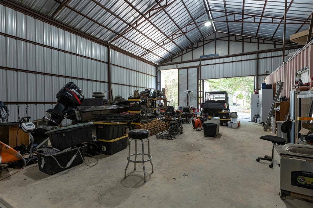 6810 Trinity Falls Parkway, McKinney, TX 75071 Metal-framed structure with a concrete floor, a corrugated metal roof, and an overhead door